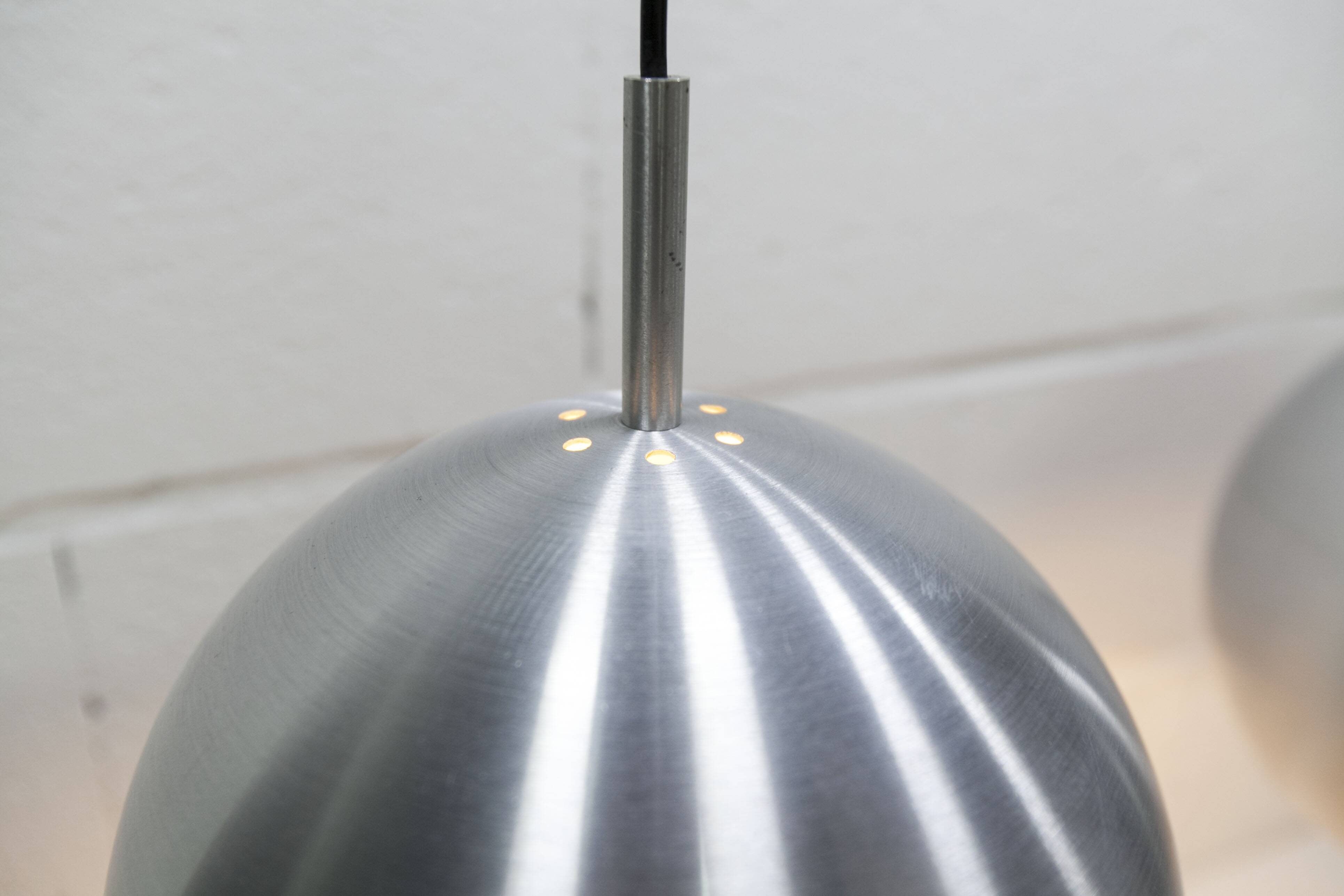 Pair of functional 70's aluminum ball pendants