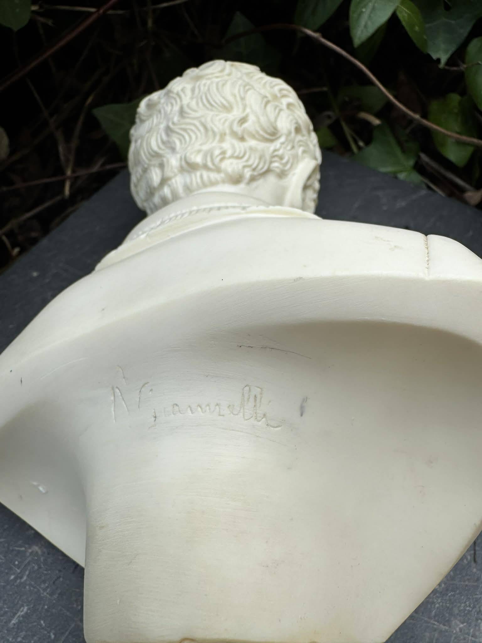 Alabaster bust of a woman signed Arnaldo Giannelli.