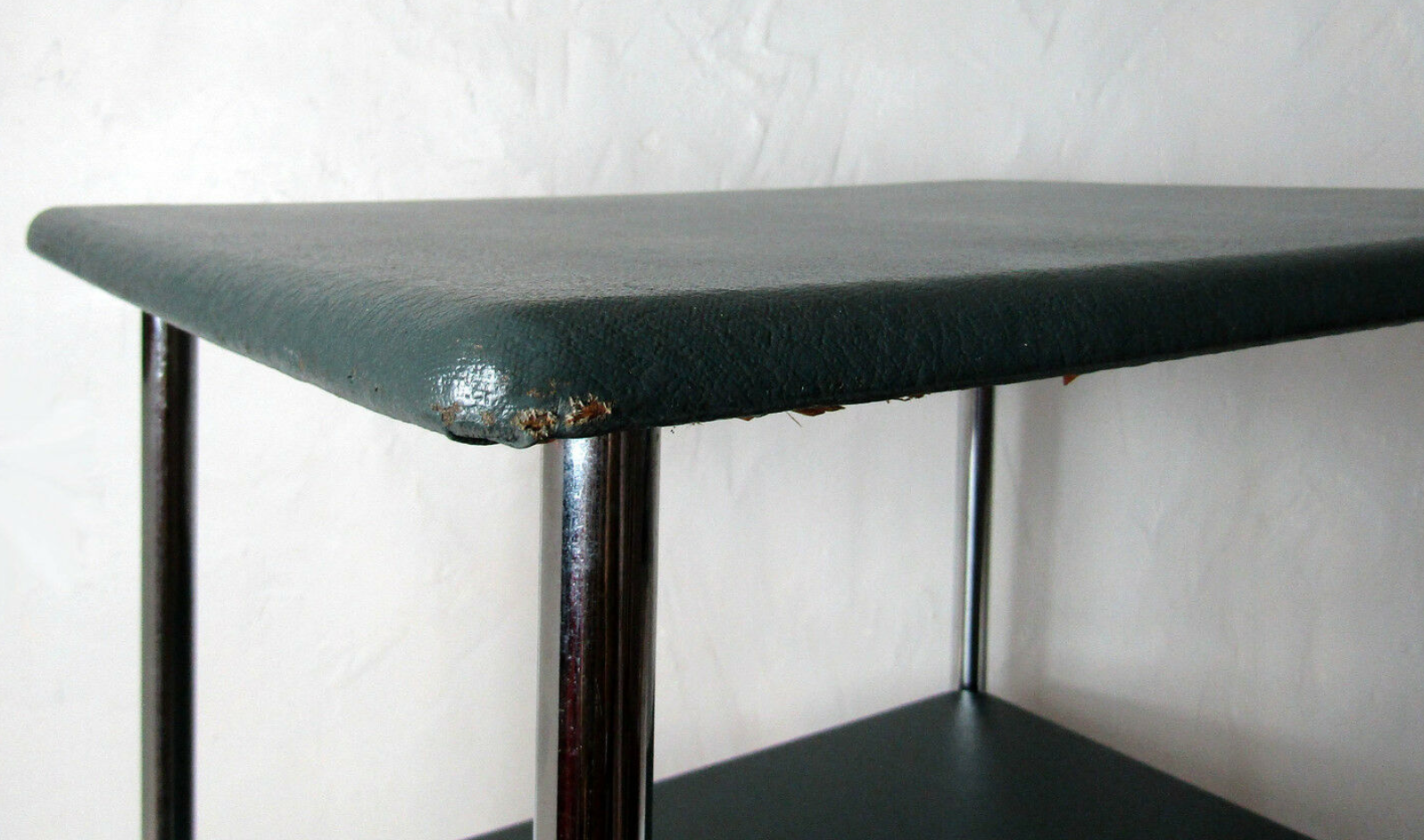 Table serves console with chrome wheels and imitation vintage khaki