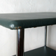 Table serves console with chrome wheels and imitation vintage khaki
