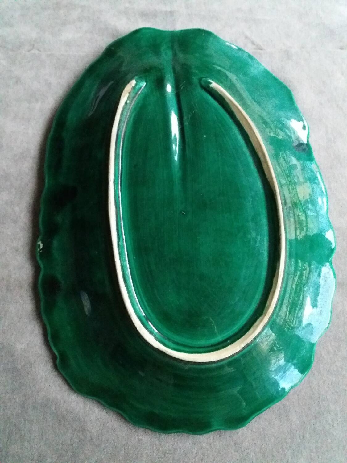 Large dish in green cabbage leaf slip