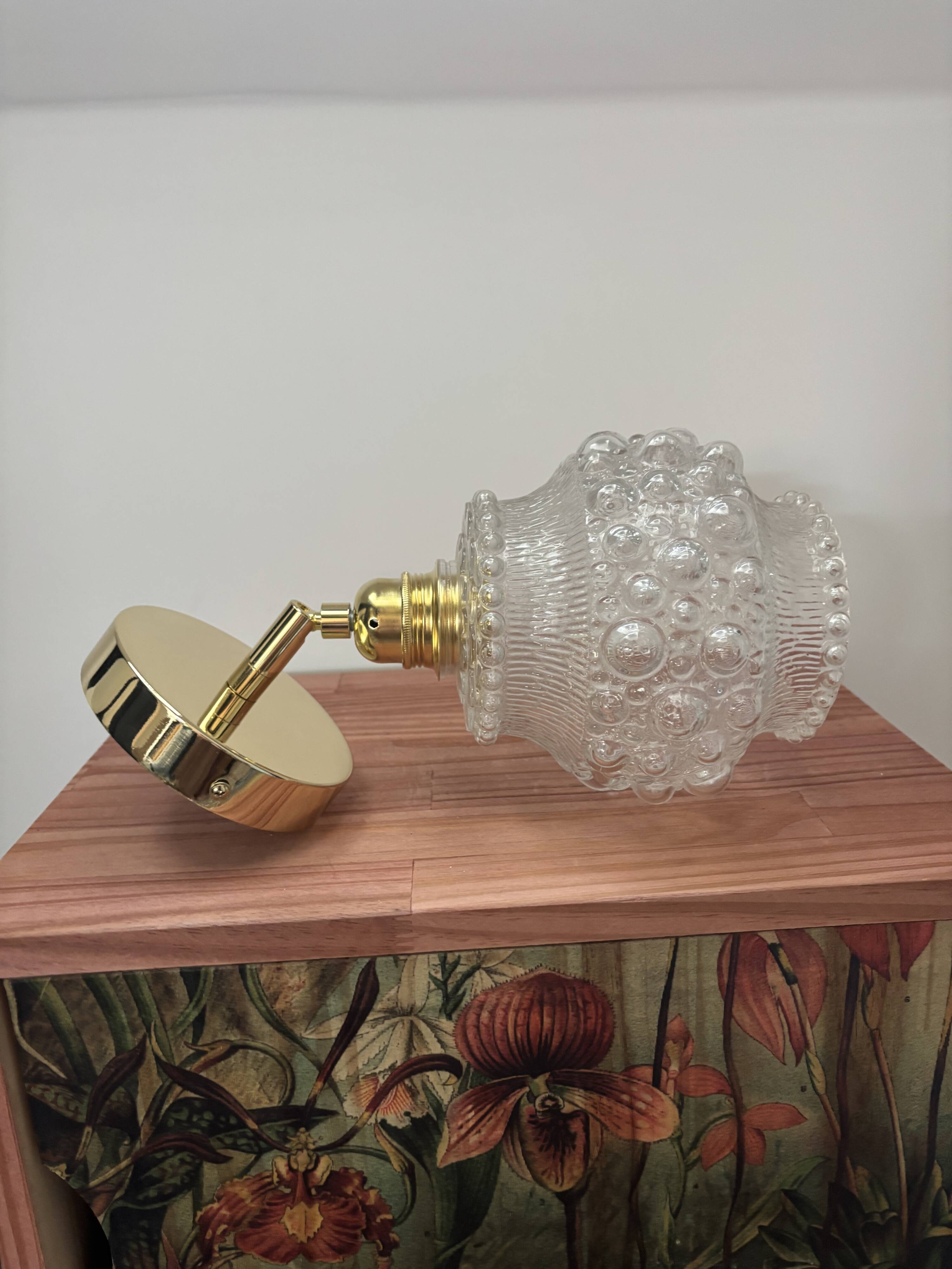 Gold wall light with bubble glass