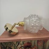 Gold wall light with bubble glass