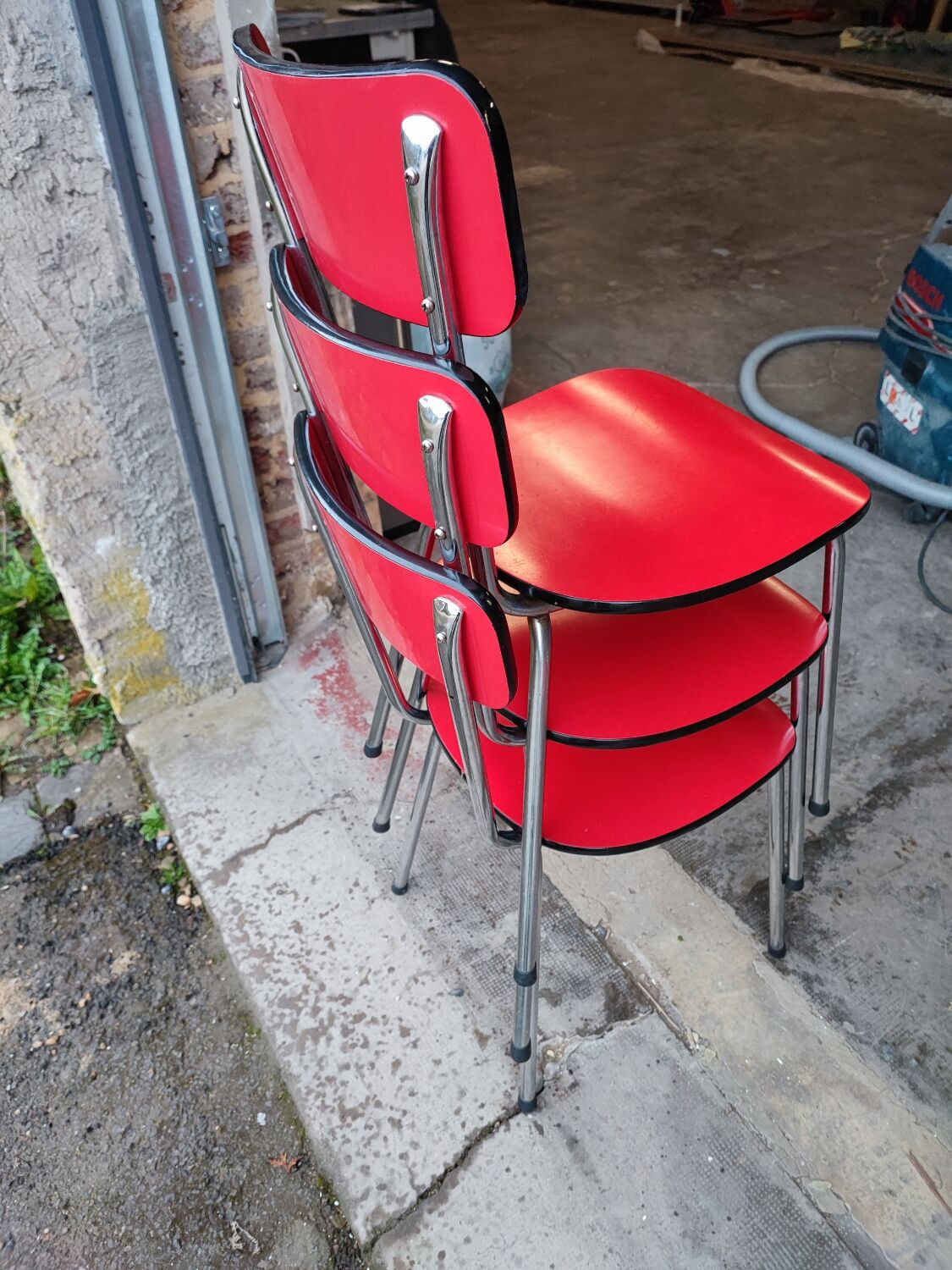 6 red and chrome Formica chairs