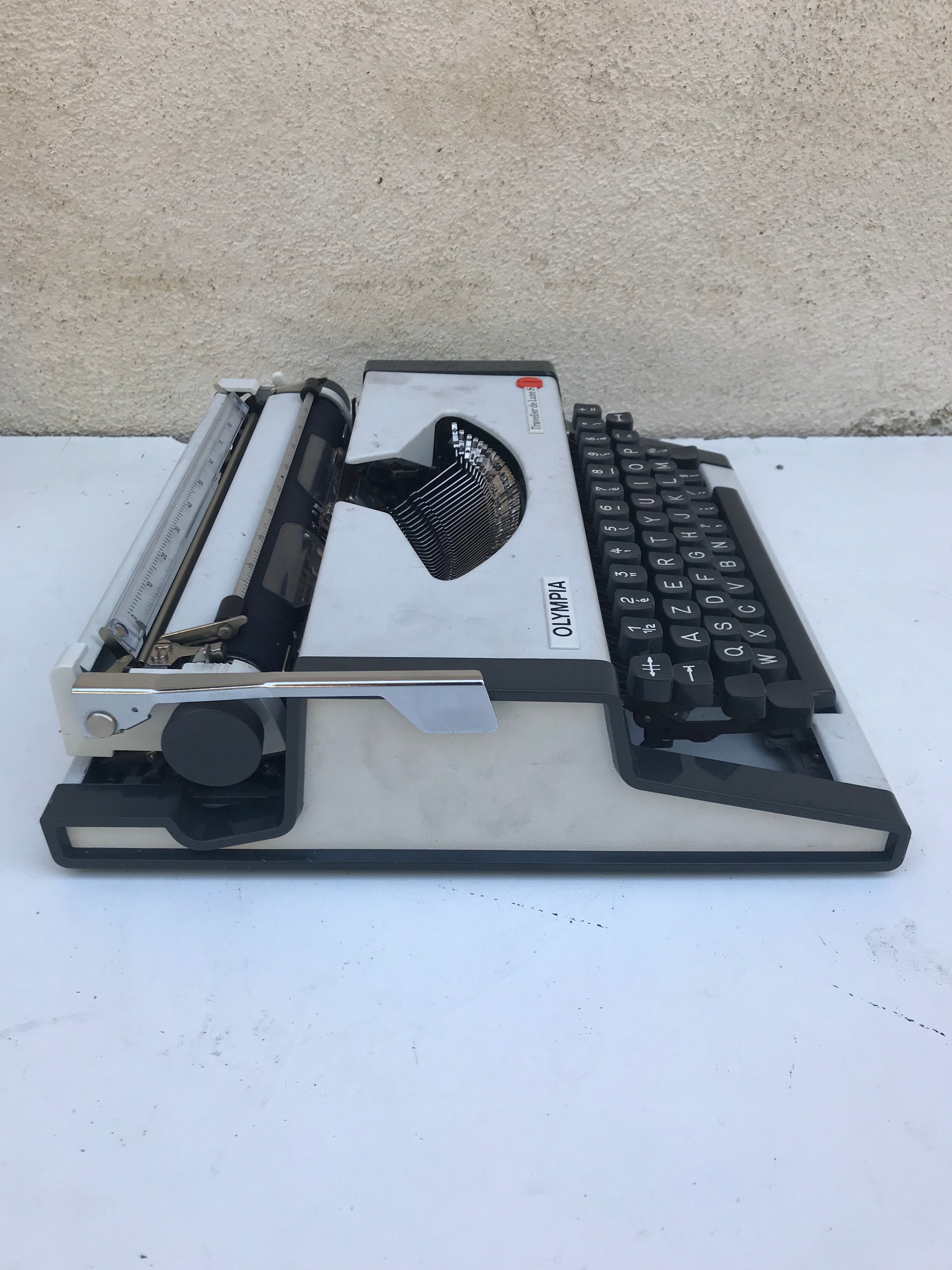 Olympia traveller luxury typewriter with its trunk