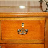 Victorian high chest of drawers in walnut with a bronze gallery.