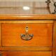 Victorian high chest of drawers in walnut with a bronze gallery.