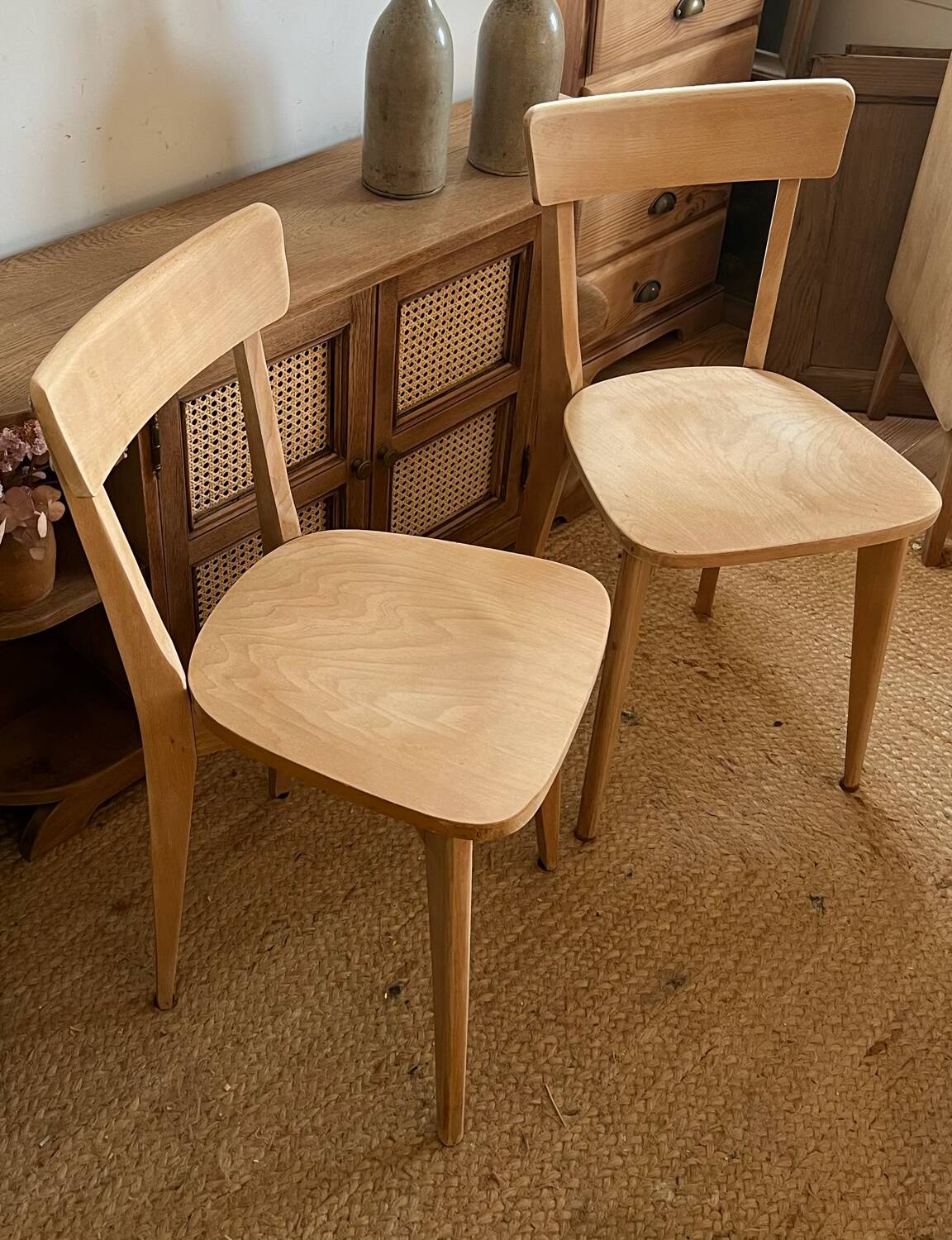 Pair of vintage bistro chairs made of raw solid wood.