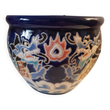 Decorative pot in multicoloured relief glazed ceramic.