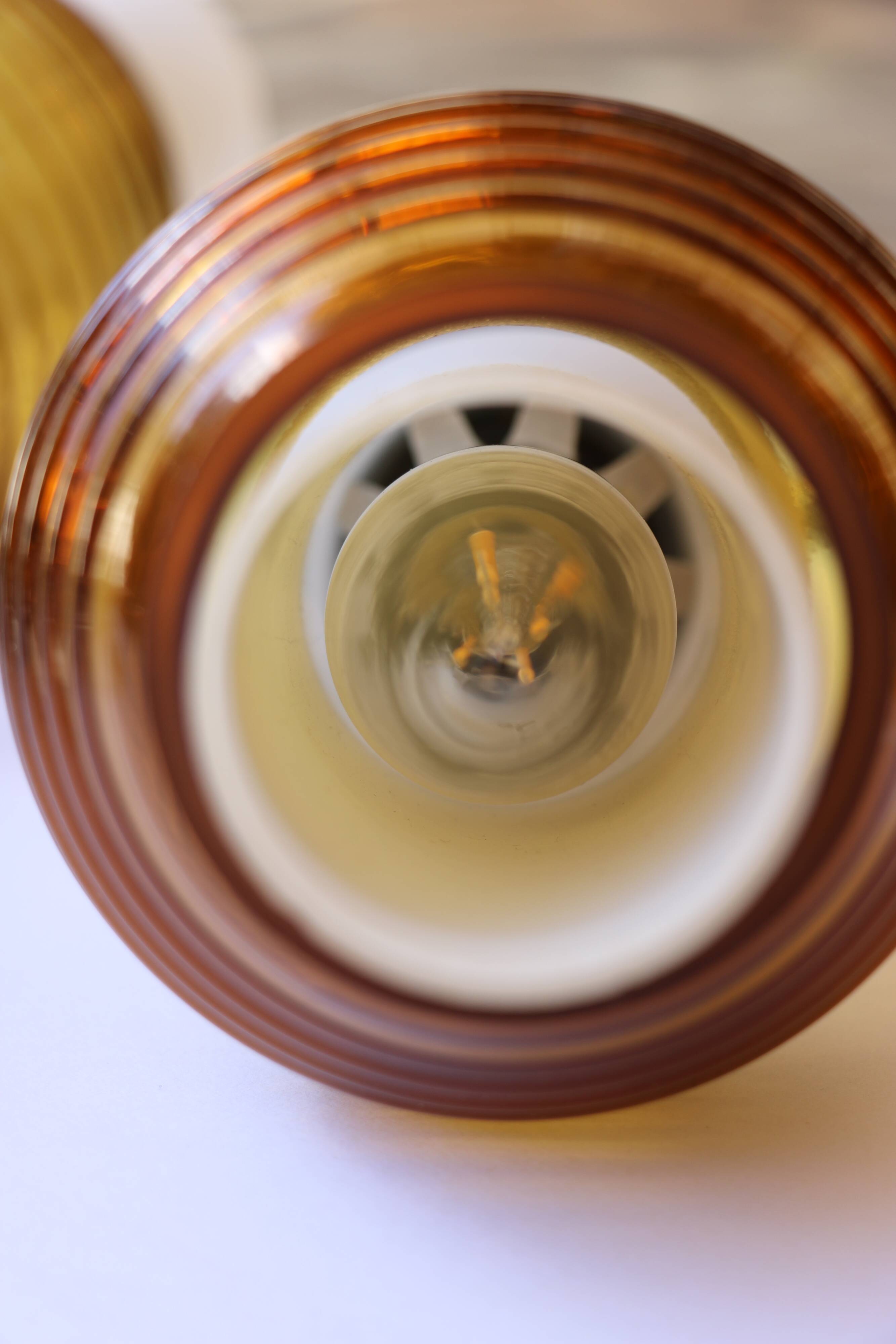 Pair of Scandinavian wall sconces, brass, opal glass and amber glass.