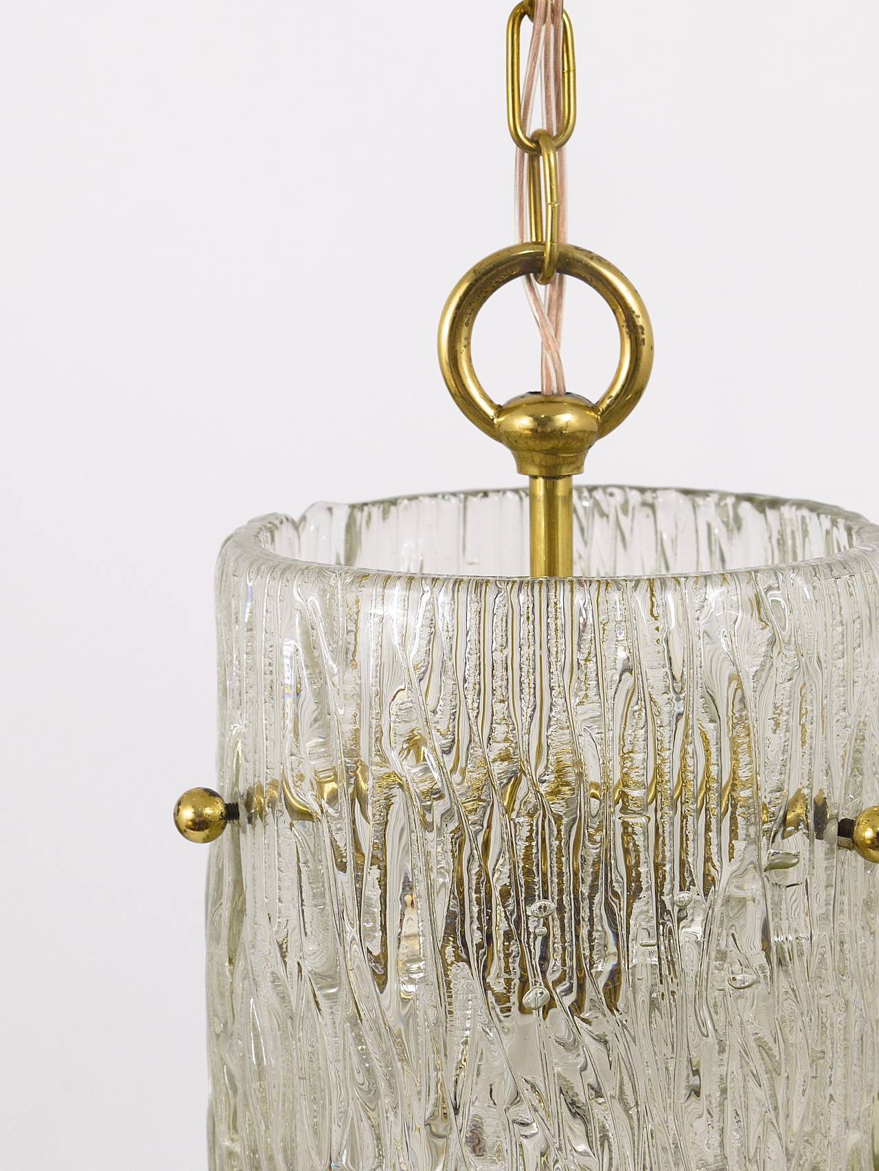 Two suspended lamps in glass and brass by J.T. Kalmar, Vienna, mid-century, Austria, 1950s.