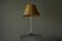 Grace table lamp in tin with rattan shade, 1930s