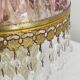 Antique pink glass pendant light with tassels.