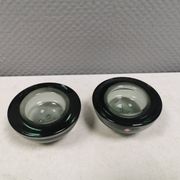 A set of iitalla candle holders in smoked transparent glass.