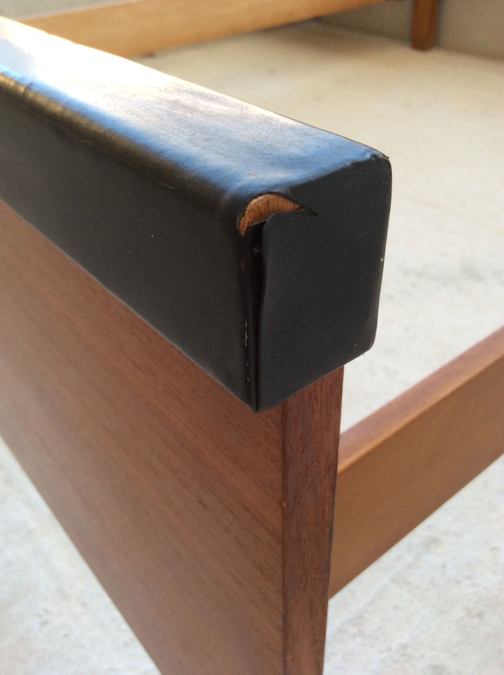 Scandinavian-style teak bed with integrated nightstands