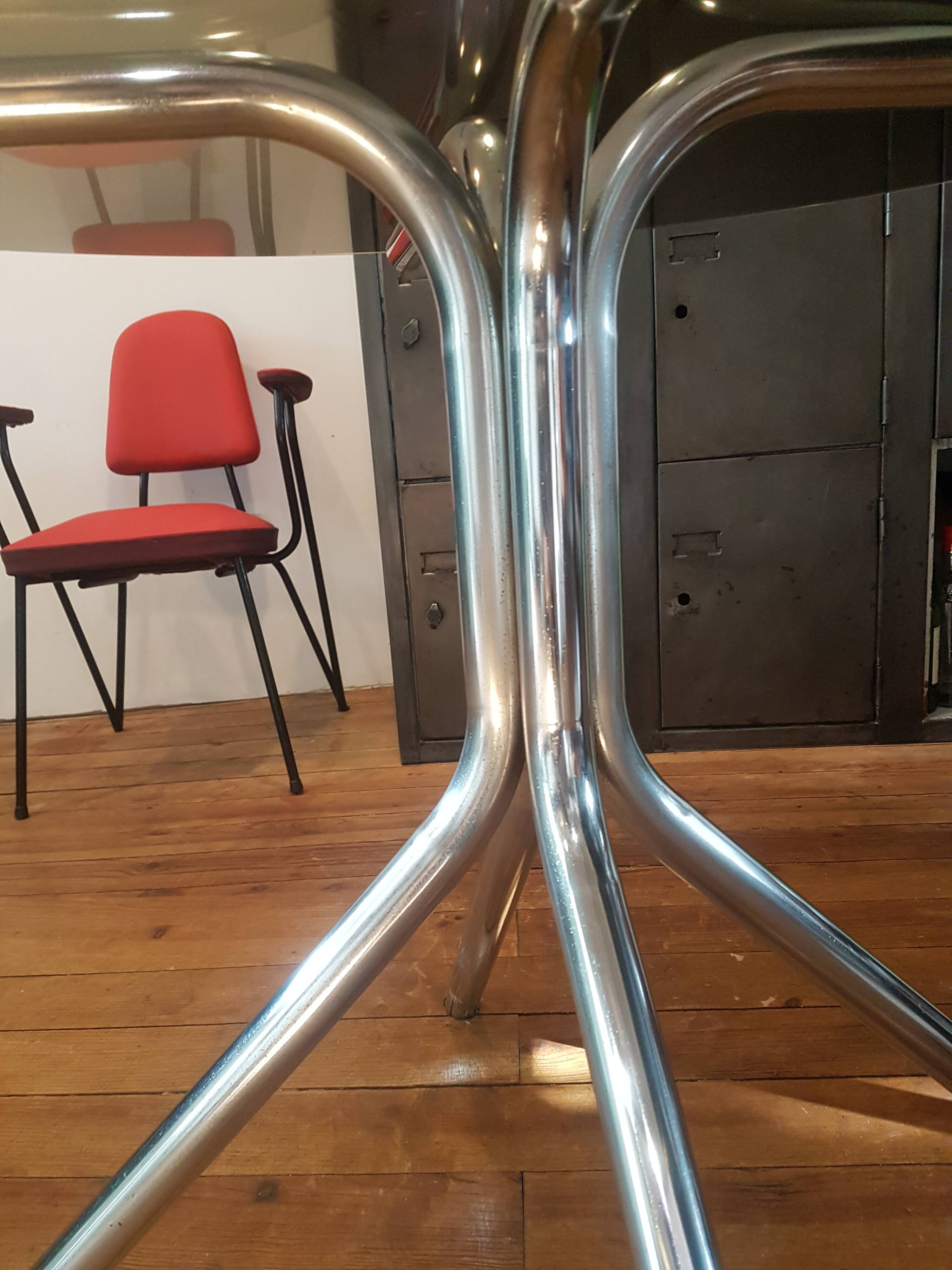 Smoked glass round table and chrome foot