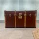 Circled travel trunk