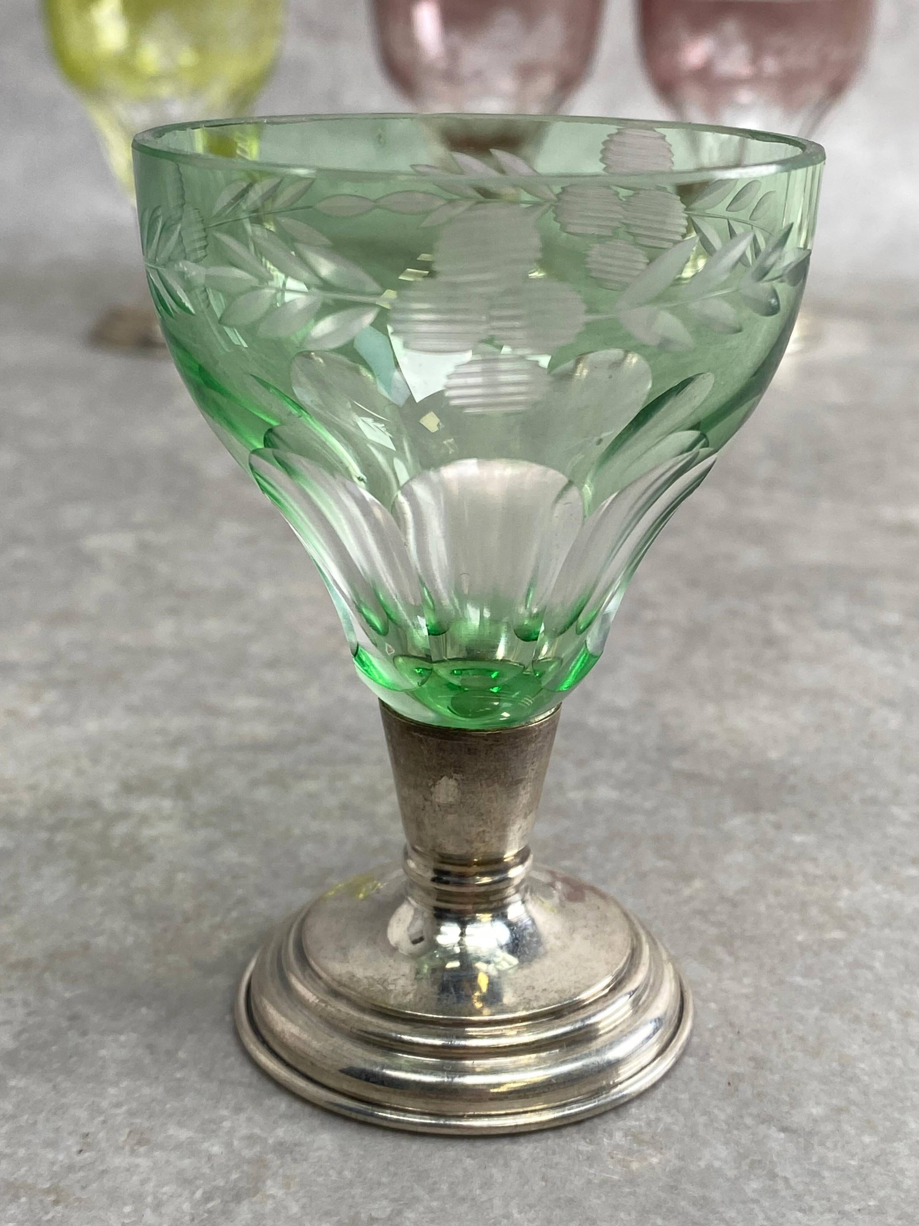 Set of 6 coloured stemmed glasses on silver stems.