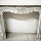 Louis XV style fireplace in veined white marble, 20th century.