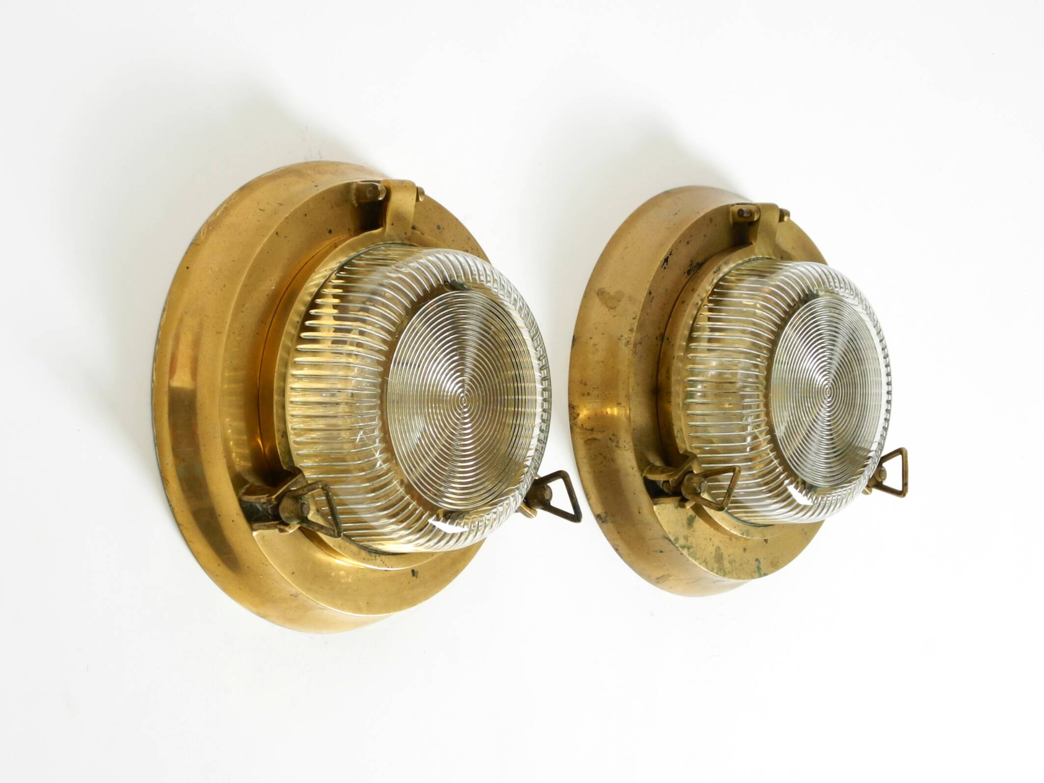 A pair of large, heavy 50s maritime ship wall lamps made of brass and glass