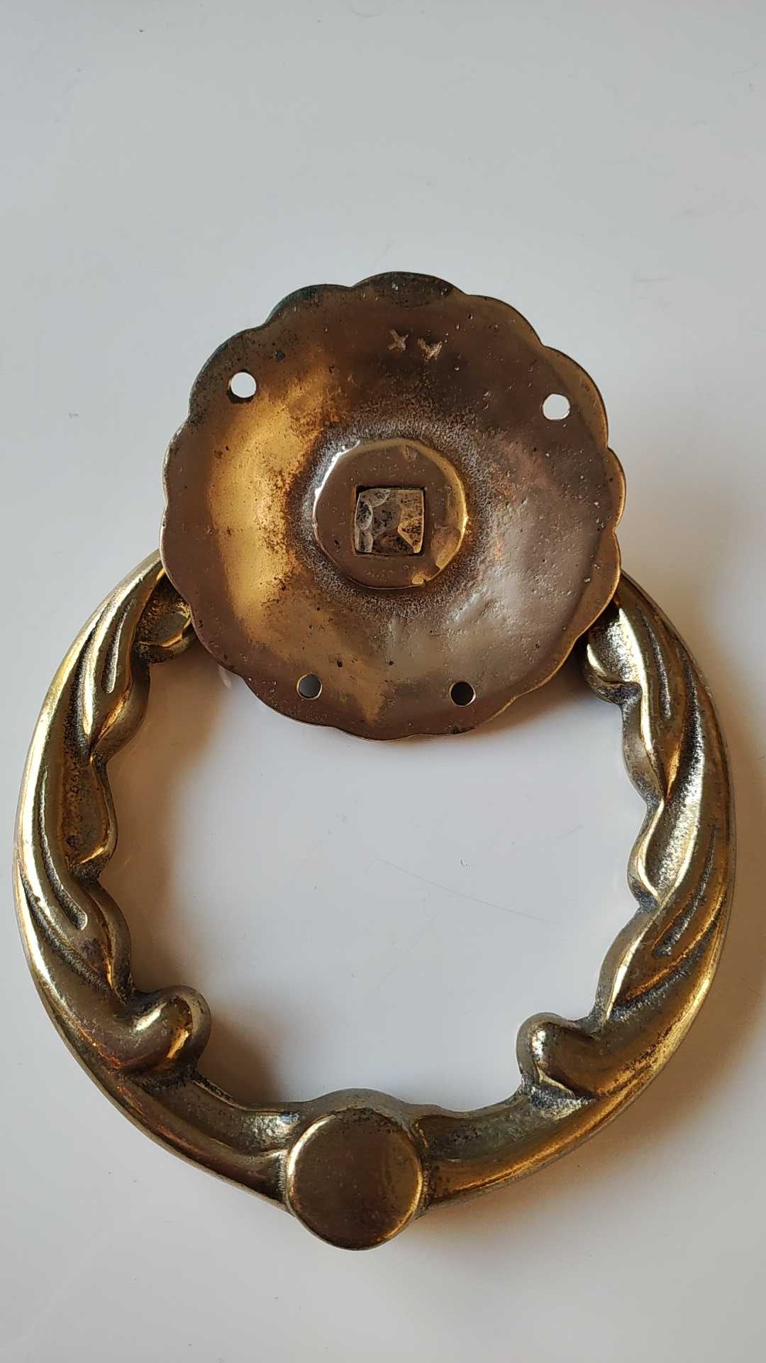 Antique door knocker/hammer of floral shape with large ring decorated with scrolls of acanthus