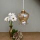 Vintage globe suspension in slightly pearly amber glass