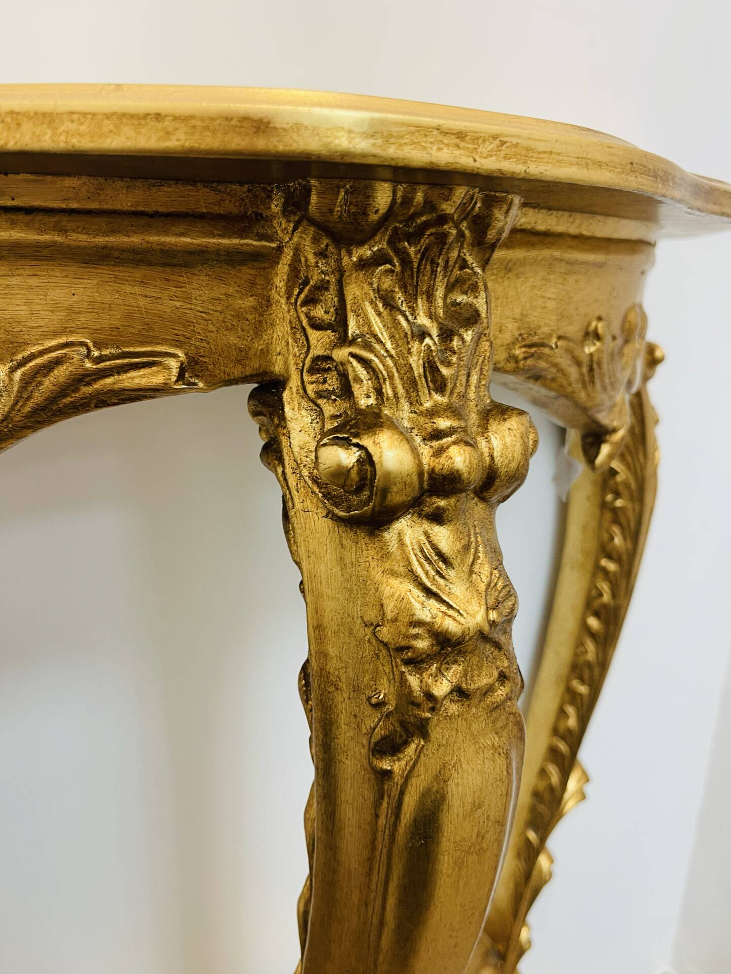 Golden console in Louis XV Rococo style made of resin.