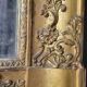 Antique Louis Philippe style gilded mirror decorated with floral motifs