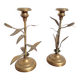 Pair of brass candlesticks with plant decoration