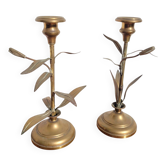 Pair of brass candlesticks with plant decoration