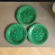 Three green slip plates