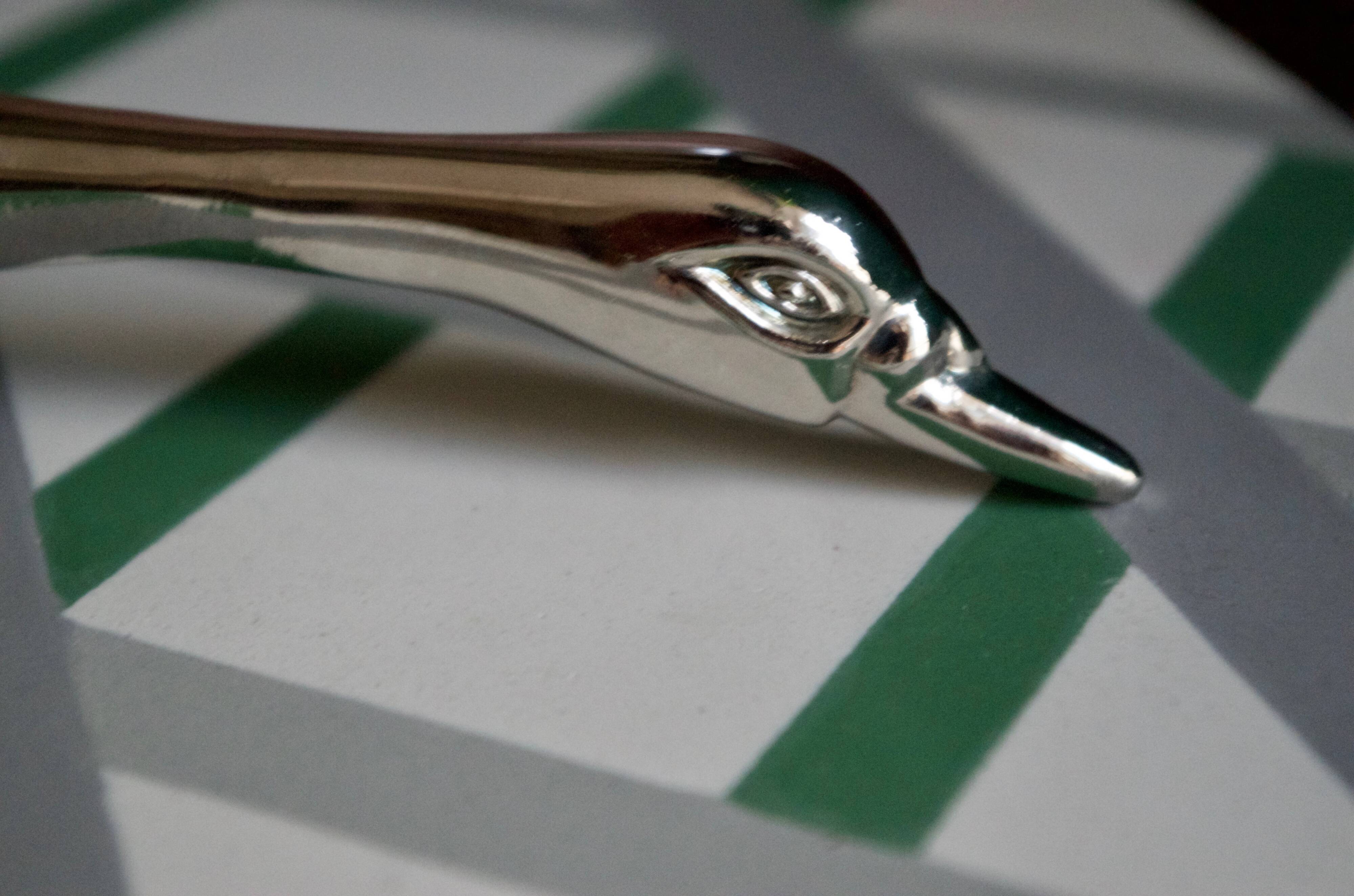 Vintage goose in flight bottle opener in silver metal