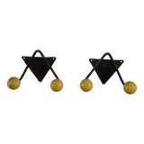 Pair of vintage black wrought iron and yellow wood coat hooks 1950