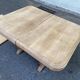 Art Deco dining table with a central pedestal, stripped in solid oak, with 2 extensions.