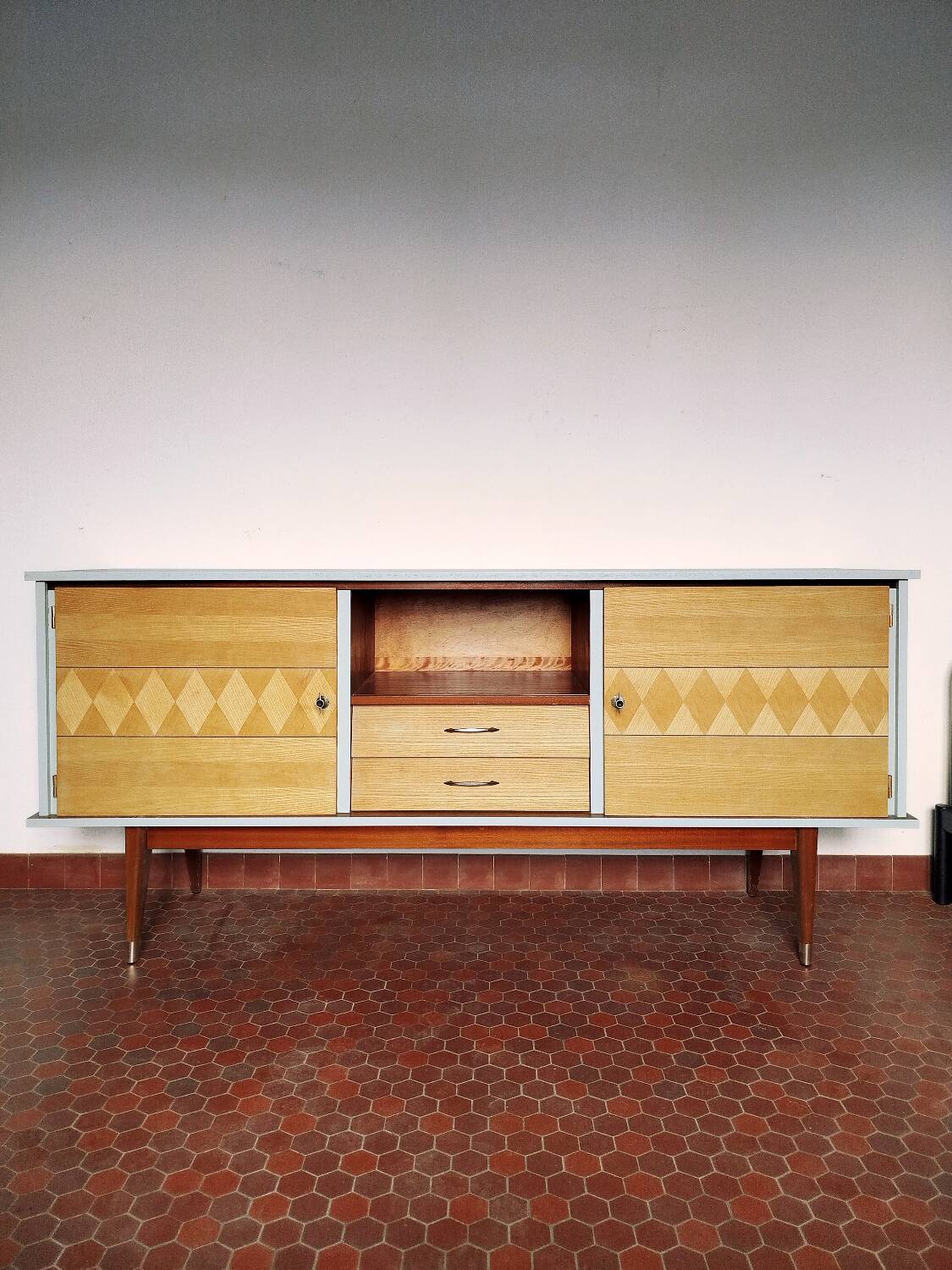 Wooden sideboard in soft green