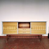 Wooden sideboard in soft green