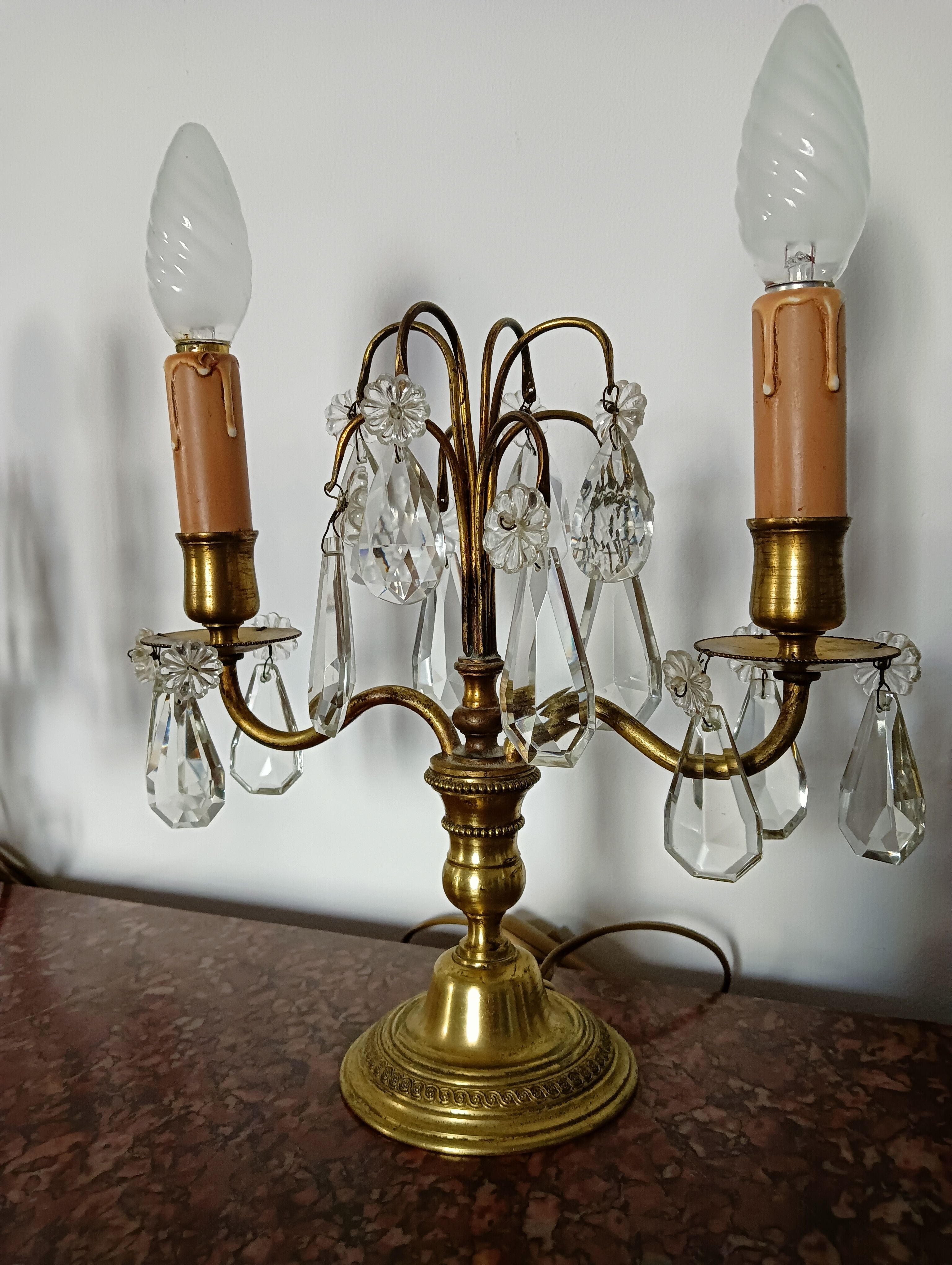 Pair of bronze girandoles with crystal pendants, two arms of lights.