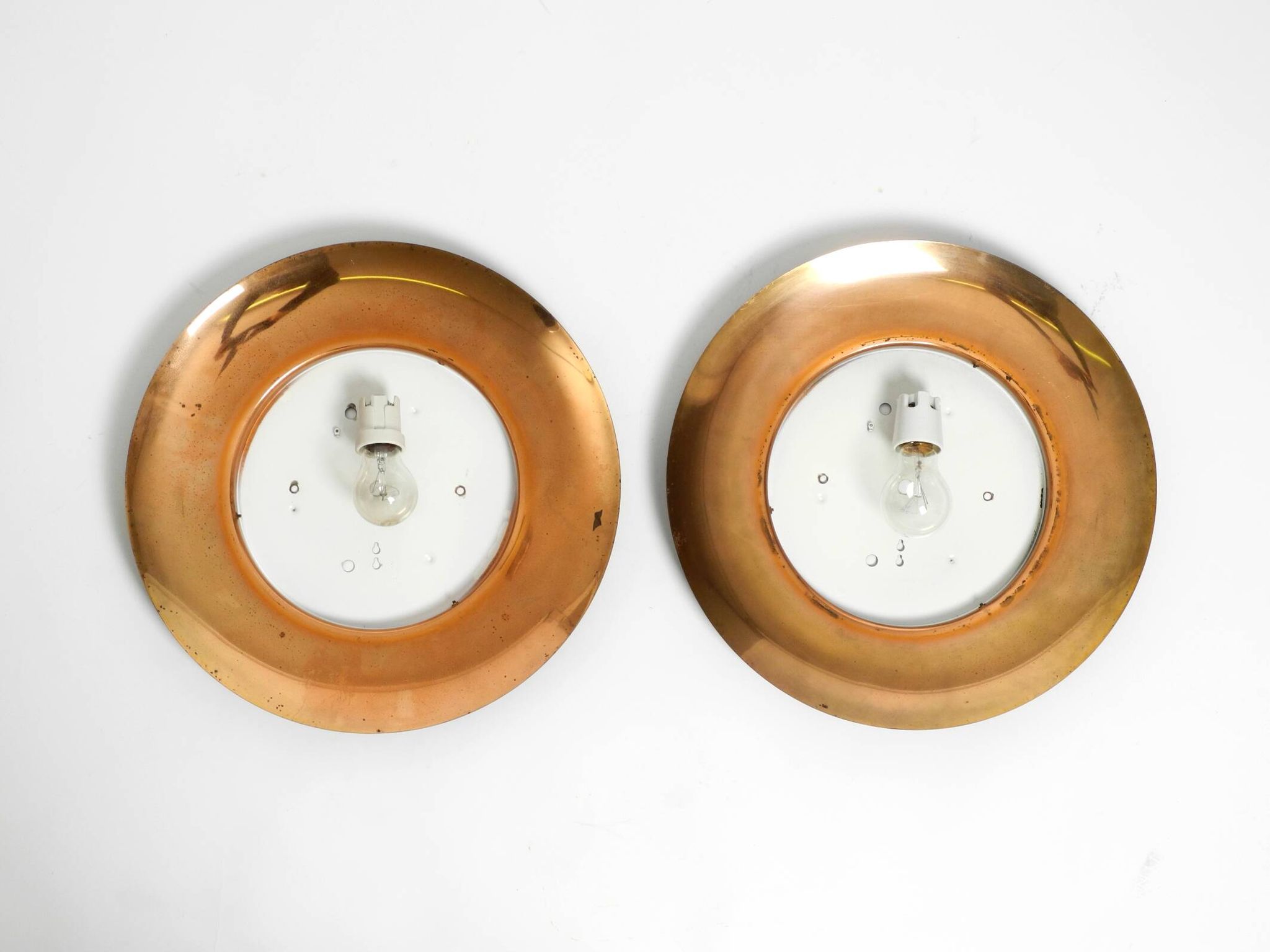 Pair of Mid Century wall or ceiling lamps made of glass with copper-plated
