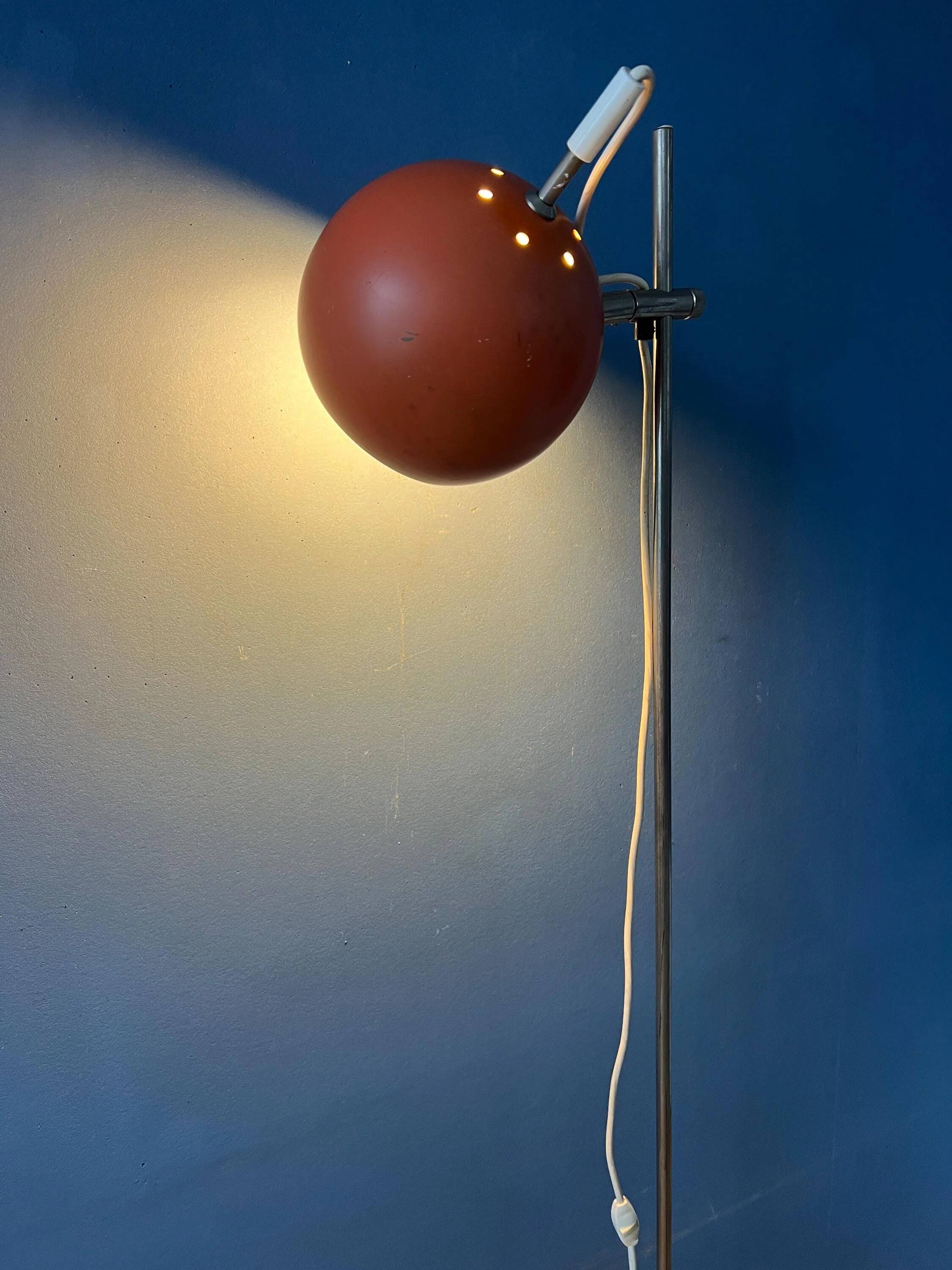 Mid-Century orange floor lamp with "eyeball" shade