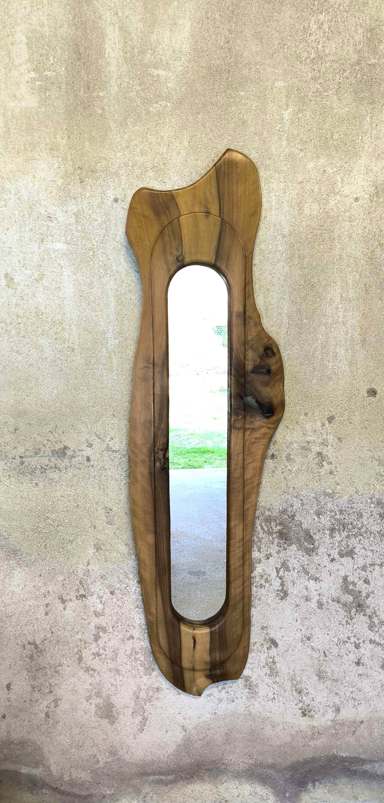 Vintage free-form mirror in solid wood.