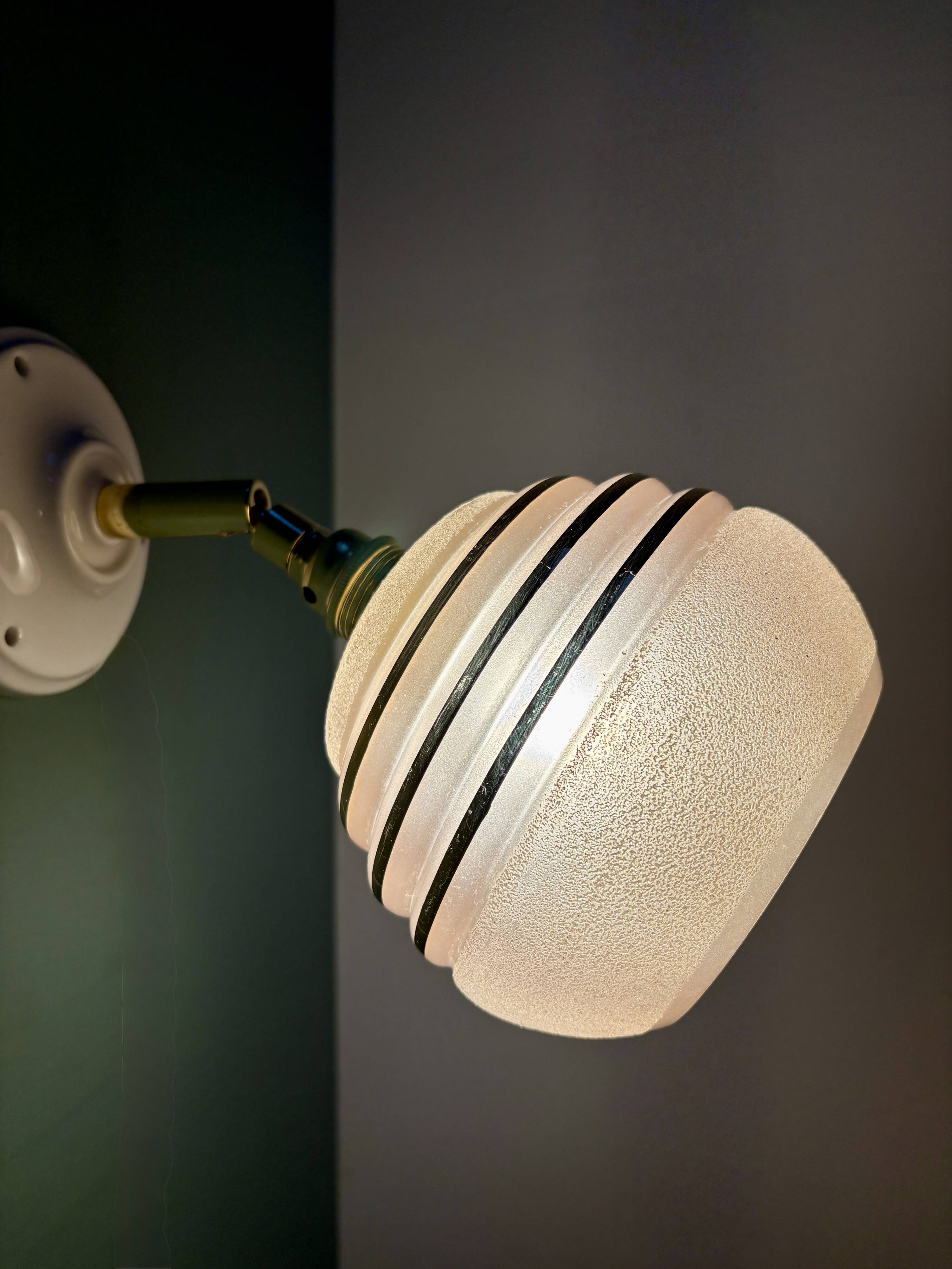 Vintage globe wall light in frosted pink and gold glass.