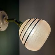 Vintage globe wall light in frosted pink and gold glass.