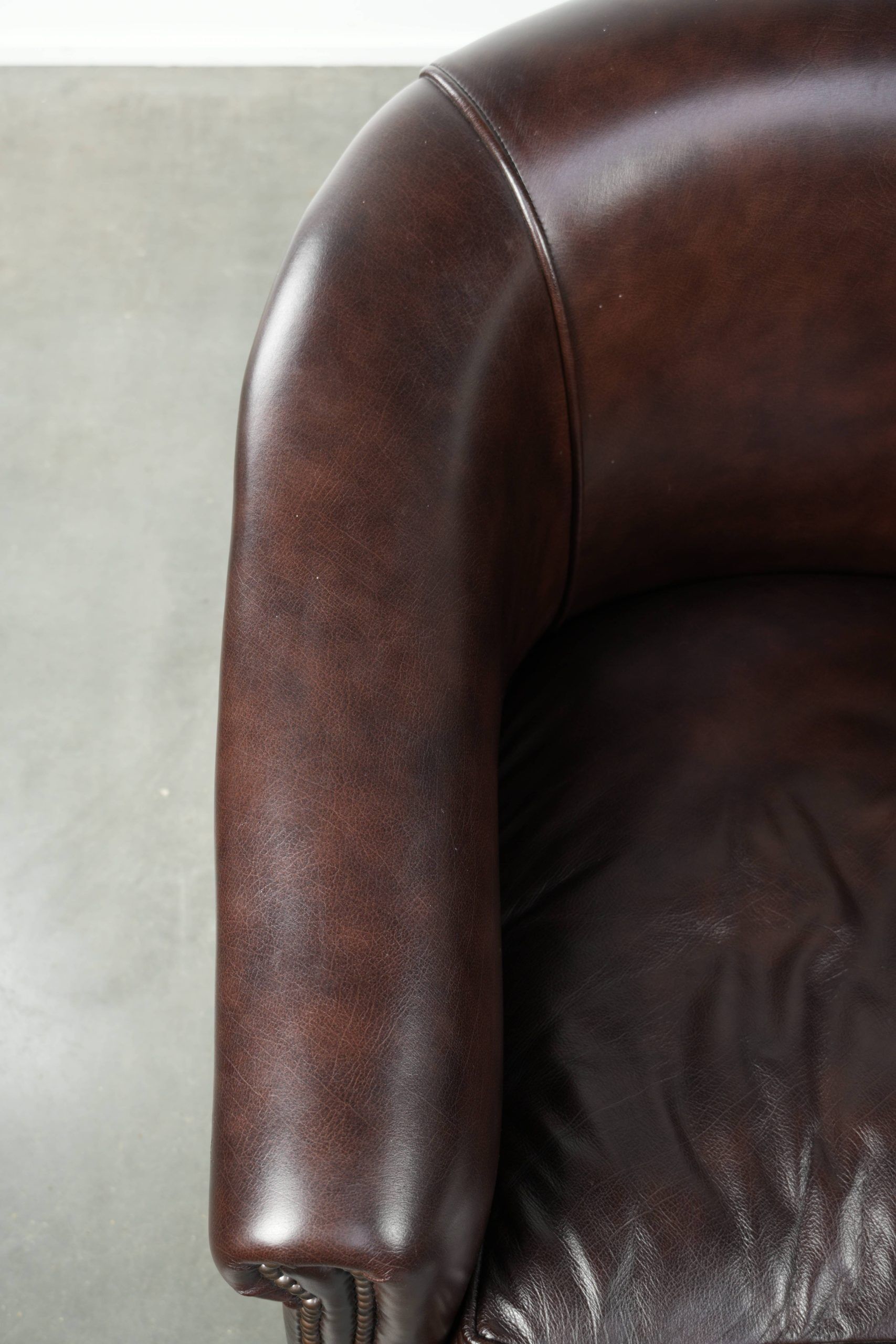 Set of two cowhide club armchairs in good condition with a English design