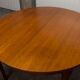 Scandinavian table in round teak with built-in extensions 1960