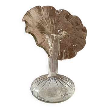 Vintage transparent glass vase in flower shape.