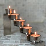 Chrome-plated metal candle holder
