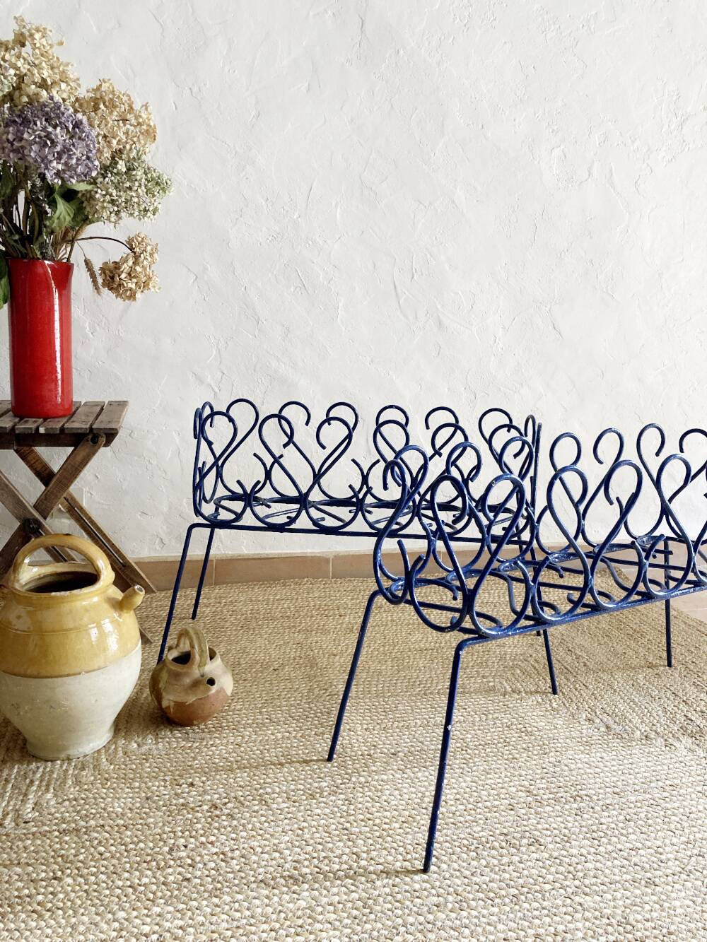 Pair of blue-painted wrought iron planters, 1960s