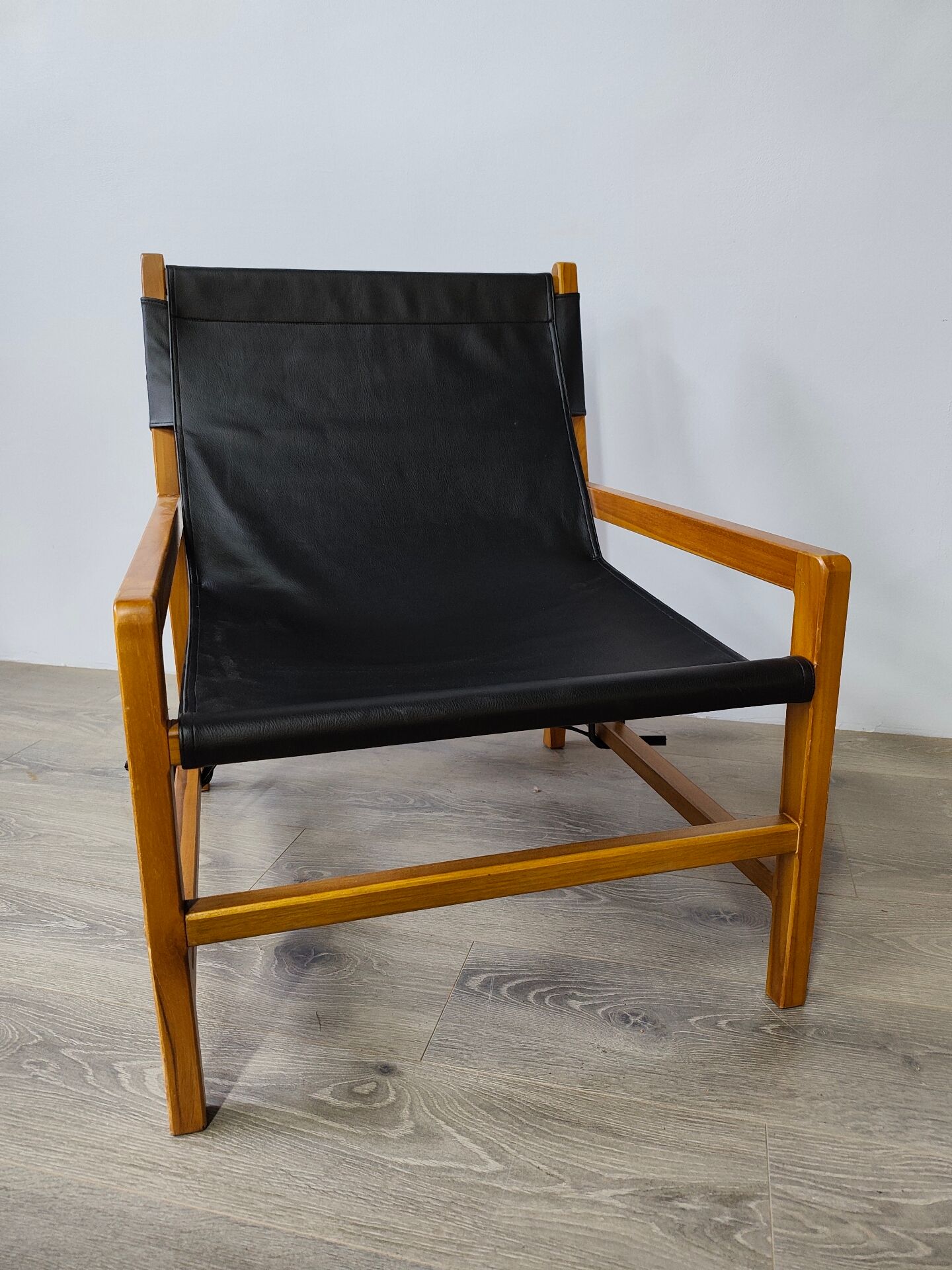 Leather and teak armchair