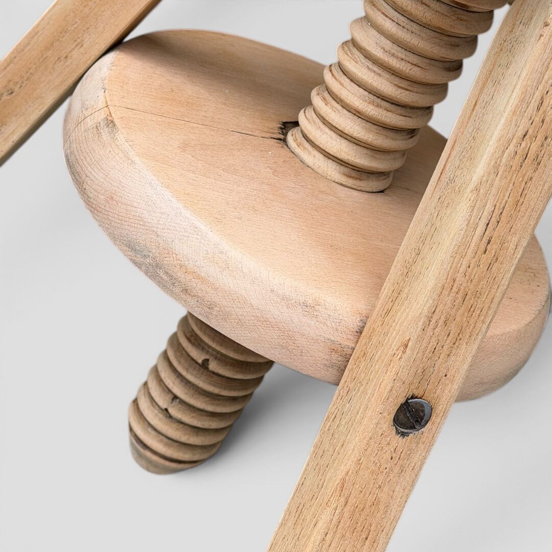 1950s solid oak tripod workshop stool with a screw mechanism.