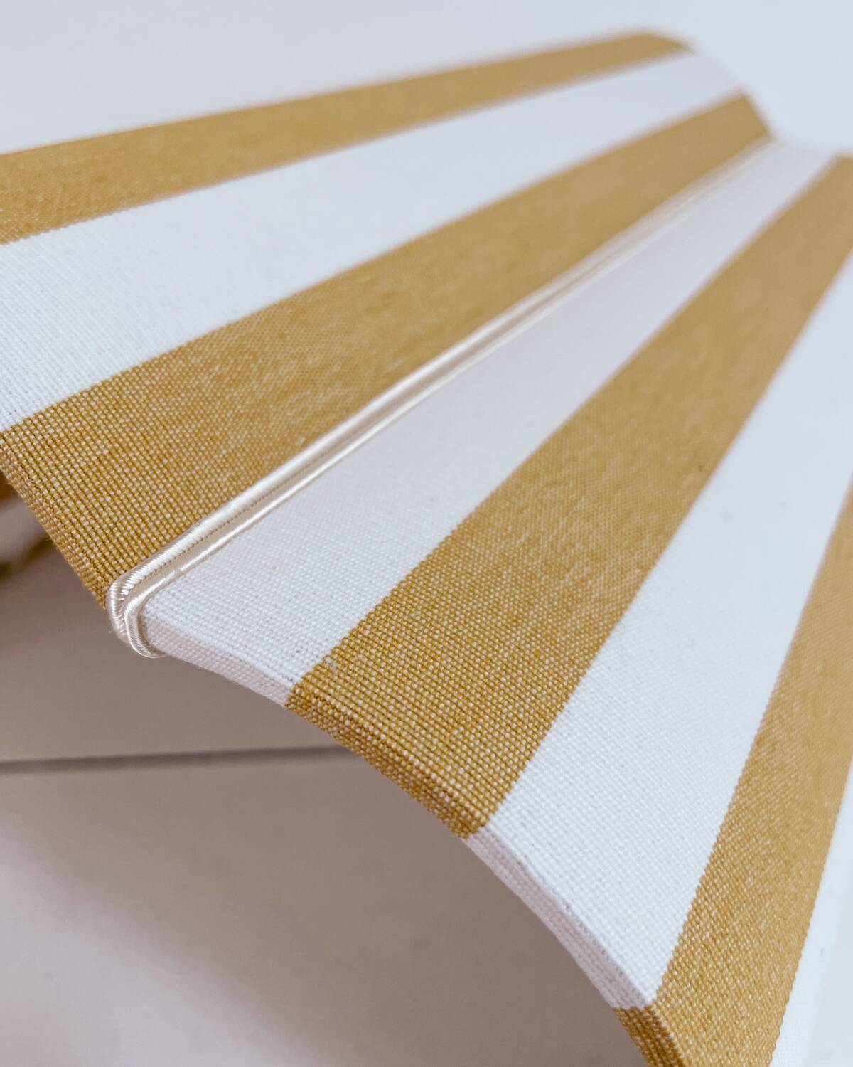 Yellow striped fabric wall light